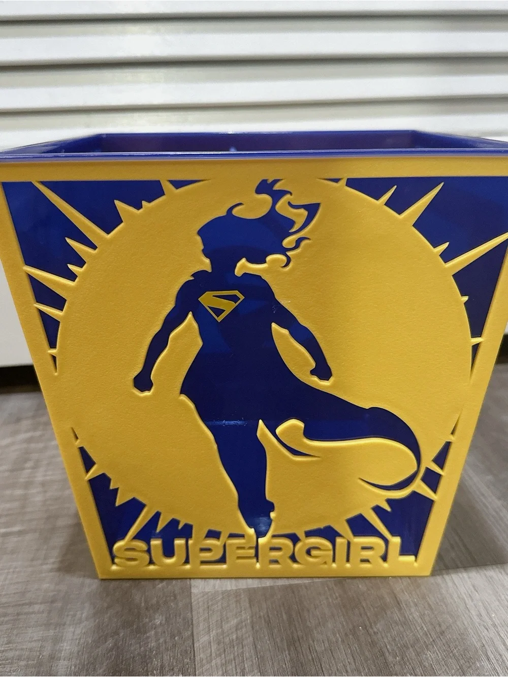Yellow and Blue Supergirl Decorative Wall Panel - Heroic Silhouette Accent